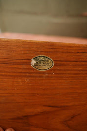 A vintage wooden teak wood chopping board for use in the kitchen.