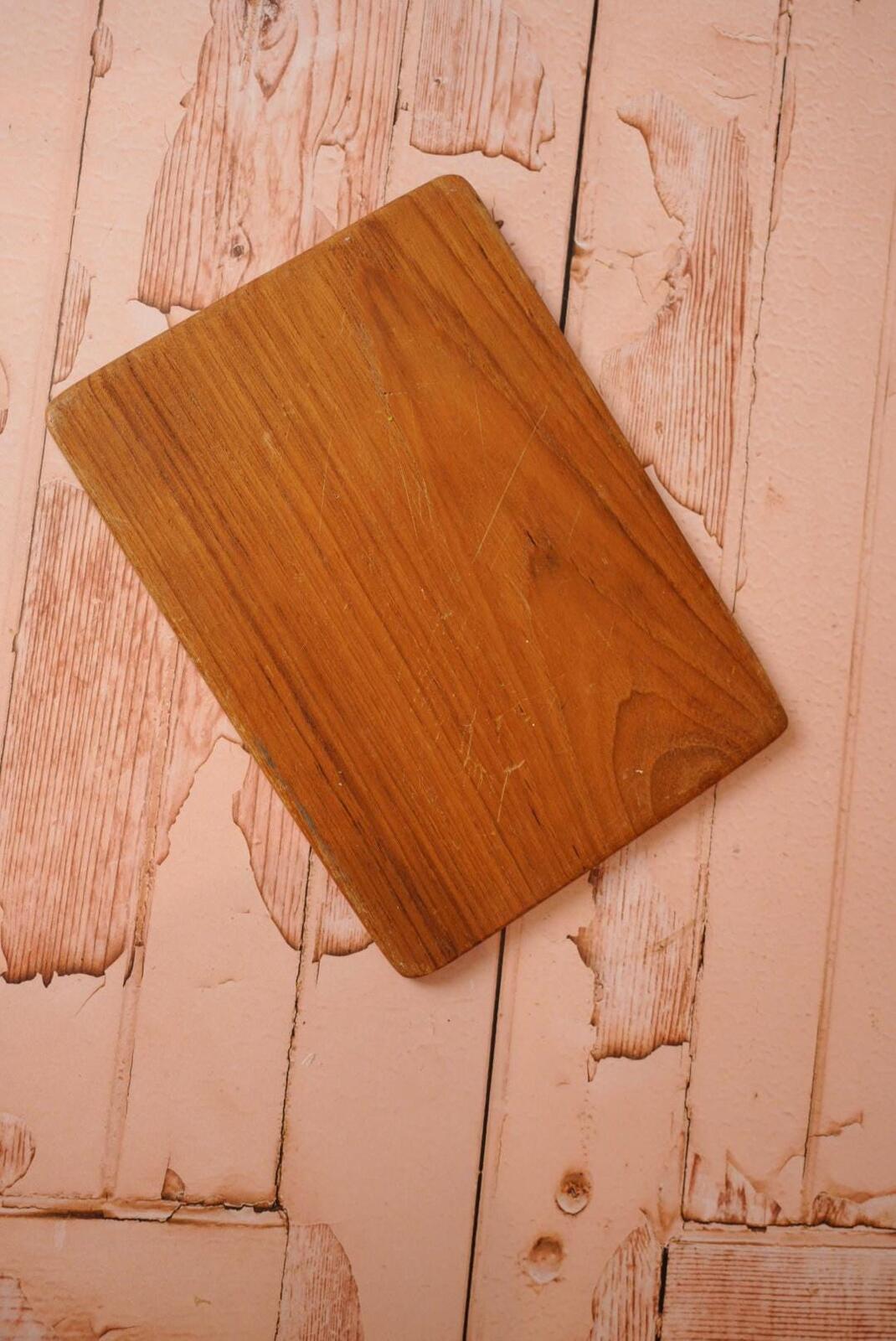 A vintage wooden chopping board for use in the kitchen.