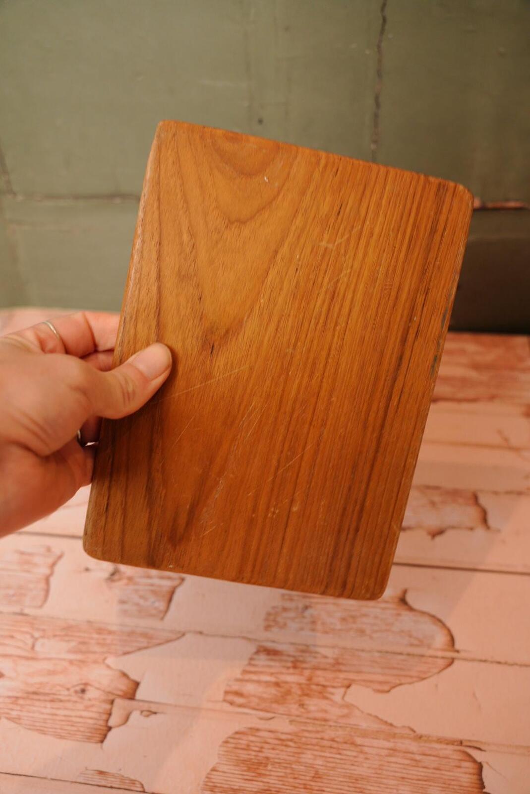 A vintage wooden chopping board for use in the kitchen.